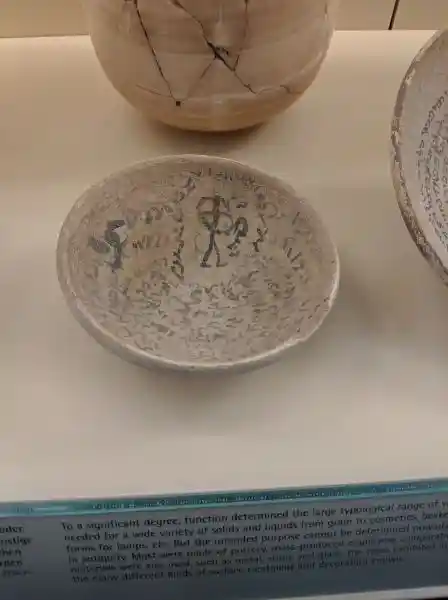 Magic bowl with inscription, ceramic, solar cross with feet, located at the Pergamon museum.